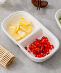 Set Of Two Divided Ceramic Dip Bowls With Stainless Steel Rims Zero Fuss Layout For Soy Sauce Vinaigrettes And Spice Mixes with lemon and chili.