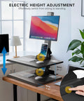 Heavy Duty Electric Standing Desk Converter With Monitor Mount And Wide Keyboard Tray, showing electric height adjustment feature.