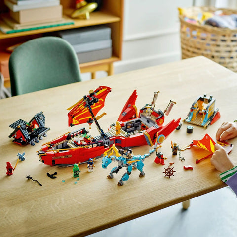 Ninjago Destiny's Bounty Race Against Time 71797 Airship Battle Set with minifigures and dragons on a table