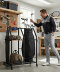 Man adjusting golf clubs on Mobile Golf Storage Organizer For Garage With Locking Casters Heavy Duty Golf Bag Rack To Move Your Gear Easily Ultimate Golf Club And Accessory Storage Solution That Keeps Bags Carts And Accessories Neat And Ready To Roll