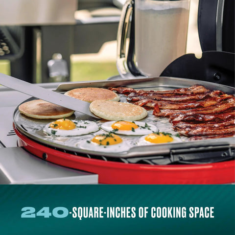 Cooking breakfast on 3-In-1 Dual Fuel Outdoor Grill And Griddle With Electric And Charcoal Modes, showing eggs, bacon, and pancakes.
