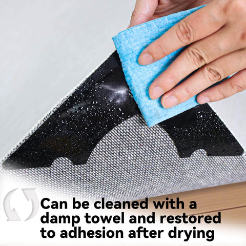 Cleaning a Non Slip Rug Corner Gripper from a pack of 8 with a damp towel to restore adhesion, showing reusable dual-sided adhesive.