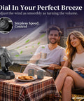 Couple enjoying outdoor camping with Portable Camping Fan With Light And Remote, Oscillating Battery Powered Tent Fan on a table.