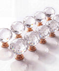 Crystal Glass Cabinet Knobs 10 Pack Diamond Cut Round Drawer Pulls With Rose Gold Base 30mm Clear Knobs in a row