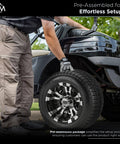 Man installing Warlock Black And Machined 10 Inch Golf Cart Wheel And Tire Kit With 205/50-10 Low Profile Tires