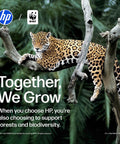 Close-up of a resting jaguar on a tree branch, promoting HP's partnership with WWF for conservation.