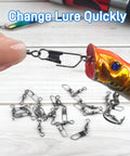 High Strength Fishing Barrel Swivels With Safety Snap Stainless Steel Barrel Swivel For Saltwater And Freshwater Copper Core With Black Nickel Finish Corrosion Resistant Smooth Rotation Solid Ring Tackle Connector, shown on lure