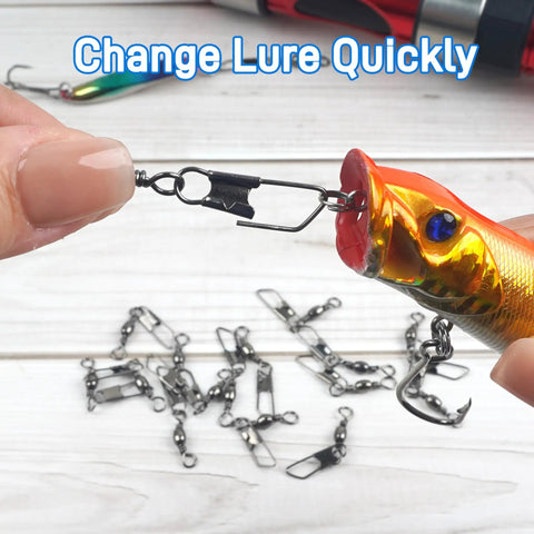 High Strength Fishing Barrel Swivels With Safety Snap Stainless Steel Barrel Swivel For Saltwater And Freshwater Copper Core With Black Nickel Finish Corrosion Resistant Smooth Rotation Solid Ring Tackle Connector, shown on lure