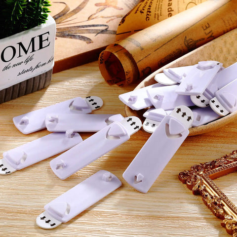 Damage Free Adhesive Picture Hangers 20 Pack No Nails Mounts That Hold Up To 4 Lbs Each displayed on wooden surface