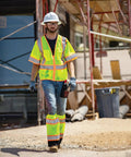 Mens Built Tough High Visibility Mesh Vest With Six Cargo Pockets And Secure Zipper Ansi Class Three worn on a construction site.