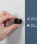 Hand holding Black Rubber Door Stops Set Of 10 Wall Mounted Floor Stopper Bumpers with impact absorption and noise reduction text