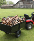 Heavy Duty ATV Trailer Steel Dump Cart 750 Lb Capacity 15 Cu Ft with logs attached to riding lawn mower for easy hauling