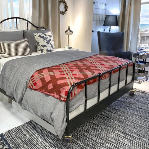 Bedroom with a metal bed on Eight Pack Heavy Duty Bed Frame Casters with Locking Swivel Wheels, showing 2 inch metal rollers.