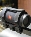 Go-To Golf Cart Speaker Mount With Adjustable Straps attached to a golf cart rail, holding a Bluetooth speaker securely