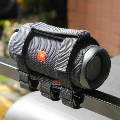 Go-To Golf Cart Speaker Mount With Adjustable Straps attached to a golf cart rail, holding a Bluetooth speaker securely