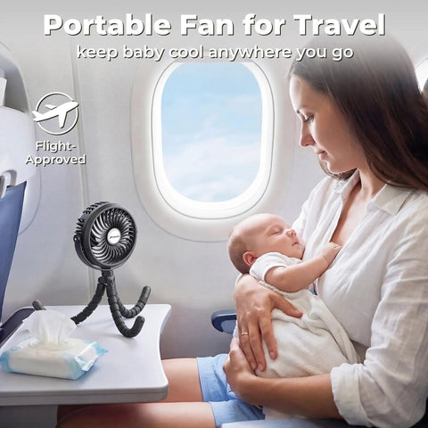Rechargeable Battery Operated Stroller Fan Clip On for Baby on airplane tray table beside mother holding baby