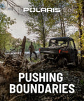 Man near Polaris ATV in forested area, showcasing adventure and rugged terrain, perfect for outdoor exploration.