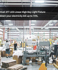 Kickass 2FT Linear LED High Bay Shop Light 165W 22000LM 5000K Crisp White illuminating a busy warehouse with workers.