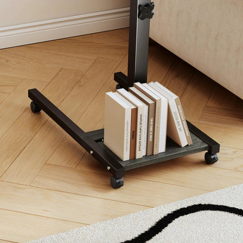 Base of Overbed Table With Wheels Adjustable Height 23 to 33 Inches showing books on lower shelf, wooden floor background