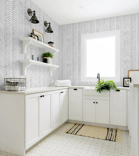 Gray Striped Peel And Stick Wallpaper Roll 17.7 Inches Wide By 394 Inches Long in a modern laundry room with white cabinets