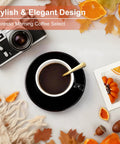 Black coffee cup with golden spoon on table with autumn leaves, camera, and photos, promoting espresso morning coffee select.