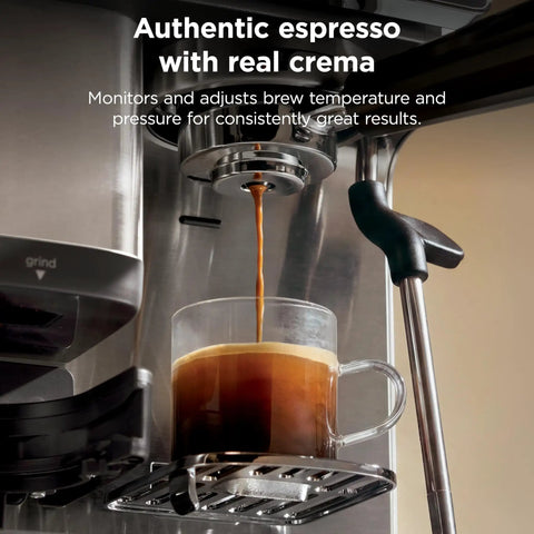 Home Barista Luxe Café Mini Espresso Machine with espresso pouring into a glass cup, showing crema and steam wand