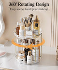 Two Tier Clear Rotating Vanity Organizer With Smooth 360 Degree Spin For Skincare And Perfume Beauty Essentials Storage on counter with bottles and jars.