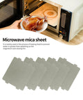 Five Pack Waveguide Covers Mica Sheets For Microwave Ovens, Universal Fit, Cut To Size 108mm By 99mm, shown near microwave