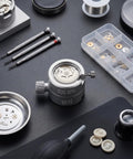 Watch Movement Holder And Base Repair Stand For 2824 2892 8200 2813 NH35 NH36 Movements on workbench with tools.