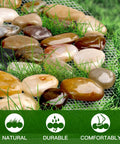 Close-up of Six Piece River Rock Stepping Stone Mat Set with polished pebbles and grass, showcasing durability and comfort for decor.
