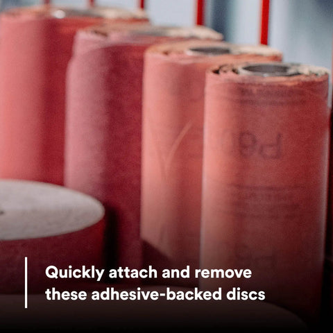 Stikit Red Abrasive PSA Disc 6 Inch P80 For Auto Body Sanding 100 Disc Roll displayed in a standing position.