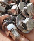 Assorted stainless steel hex bolts with flat and lock washers, nuts (3/8-16 x 1-1/4), 8 sets