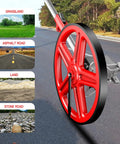 Close-up of 12 inch Distance Measuring Wheel With Marking Flags on asphalt, showing versatility on grass, stone, and land surfaces