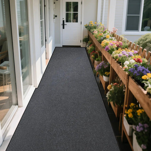 Heavy Duty Indoor Outdoor Entrance Mat 4 By 10 Feet Rubber Border Door Rug on porch with flowers, textured charcoal grey surface.