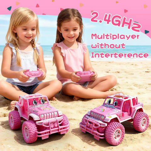 Two girls playing with Rechargeable Remote Control Car For Kids 1:16 Scale, 2.4Ghz Off Road RC Truck With Stickers on a sandy beach.
