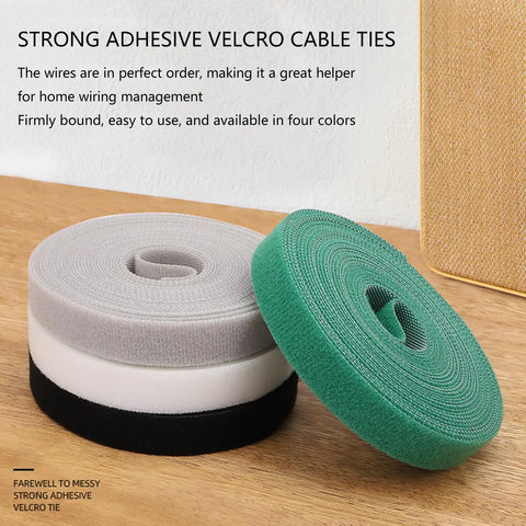 Heavy Duty Reusable Cable Management Straps White Tearable Cord Organizer Tie For Computer Speaker Guitar Wires on a wooden surface.