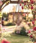 Hummingbird Hot Air Balloon Hanging Solar Lantern 1 Pack for Garden Decor in rose garden, brass color, 10.6 inches tall