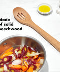 Three Piece Wooden Utensil Set With Solid Beachwood Spoon Slotted Spoon And Turner For Everyday Cooking No Fuss Kitchen Tools Built To Stir Lift And Serve Like A Pro featuring slotted spoon with mixed vegetables in pot.