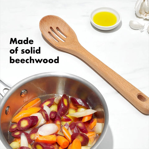 Three Piece Wooden Utensil Set With Solid Beachwood Spoon Slotted Spoon And Turner For Everyday Cooking No Fuss Kitchen Tools Built To Stir Lift And Serve Like A Pro featuring slotted spoon with mixed vegetables in pot.