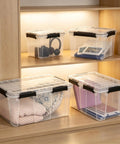 Heavy Duty Clear Plastic Storage Tote With Secure Lock Latch 54 Quart Transparent Waterproof Crate housing blankets and books.