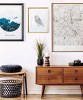 Heavy Duty Picture Hanging Strips Solid As A Rock For Wall Frames And Decor, Zero Wall Damage, Super Durable Adhesive Holds Firm Without Any Nails, No Sweat Installation, Bright White hanging picture frames on a wall above a wooden console table.
