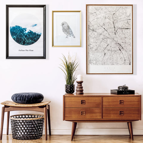 Heavy Duty Picture Hanging Strips Solid As A Rock For Wall Frames And Decor, Zero Wall Damage, Super Durable Adhesive Holds Firm Without Any Nails, No Sweat Installation, Bright White hanging picture frames on a wall above a wooden console table.