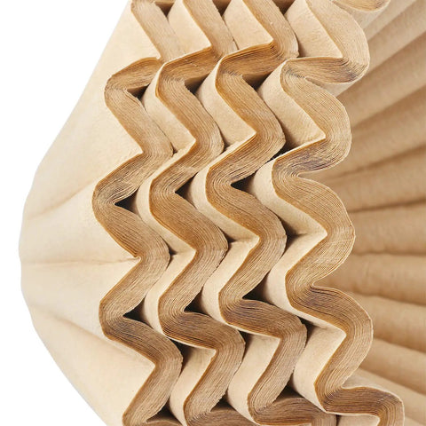 Close-up of folded Disposable Coffee Filters For 1 To 4 Cup Basket Makers, Natural Brown Unbleached, 100 Count Pack.