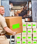 Worker loading boxes with 3 X 5 Inch Rectangle Adhesive Color Coding Stickers Fluorescent Green 250 Count Pack on a truck