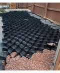 Gravel Grid Paver 5cm Stabilizer For Driveways Patios And Gardens Cuttable Base installed with gravel support along a wooden fence