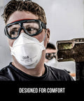 Worker wearing Particulate N95 Respirator 9205 Flat Fold Lightweight Non Valved 20 Count Pack NIOSH Approved in workshop