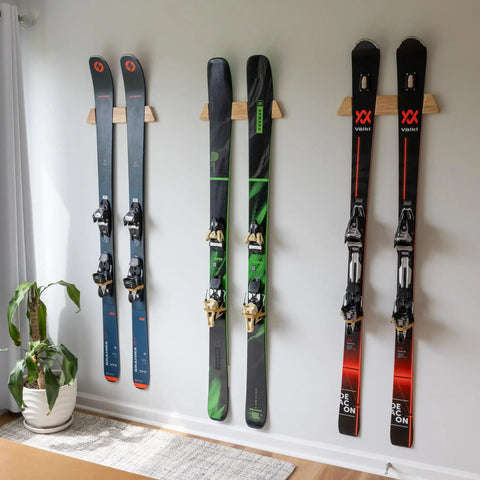 Dope Horizontal Wood Ski Rack Wall Mount With Calibrated Brackets Natural Oak Finish Heavy Duty Storage For Garage Cabin Game Room Holds Fifty Pounds, showcasing four skis mounted on a wall.