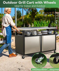 Rolling Outdoor Kitchen Island With Stainless Steel Table Top, BBQ Grill Cart, woman pushing in garden setting