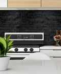 Kitchen with 10 Sheet Peel And Stick Backsplash Subway Tile For Kitchen And Bathroom Metal Embossed Bright Black Aluminum Composite 3D Wall Tile No Grout Easy Install DIY Friendly behind stove.