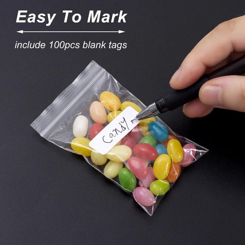 300 Clear Mini Plastic Baggies Two Point Two By Three Inch Reclosable Bags For Beads Jewelry Pills Screws Crafts And Packaging Food Grade Safe Easy Seal Resealable Poly Bags With Blank Sticker Tags shown with candy